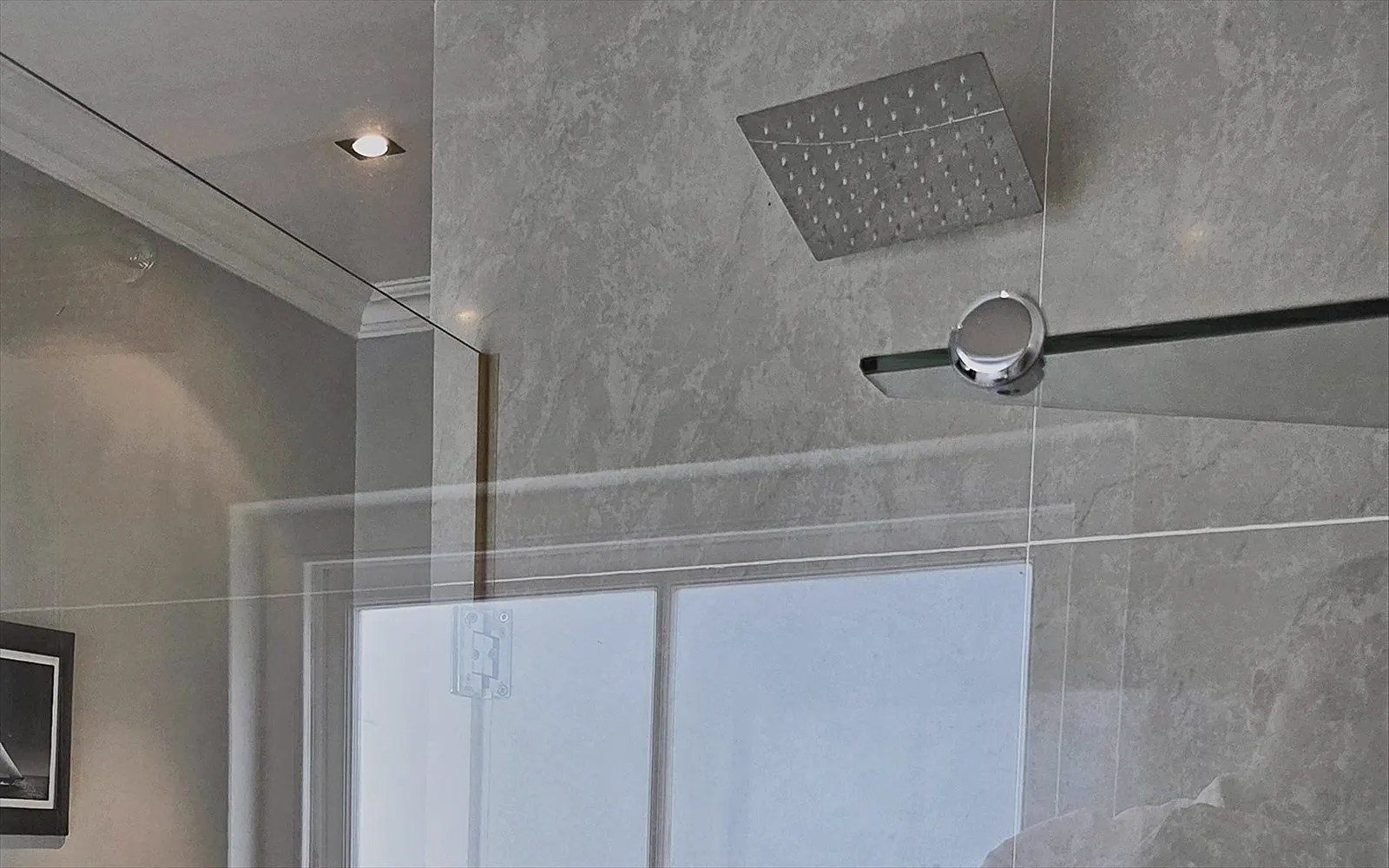 The private bathroom with walk-in rain shower, just next to the room