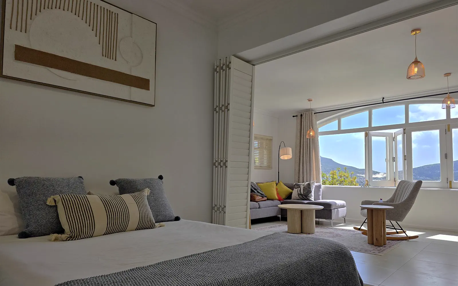 The Lodge bedroom, looking through to the living room and the view over Hout Bay